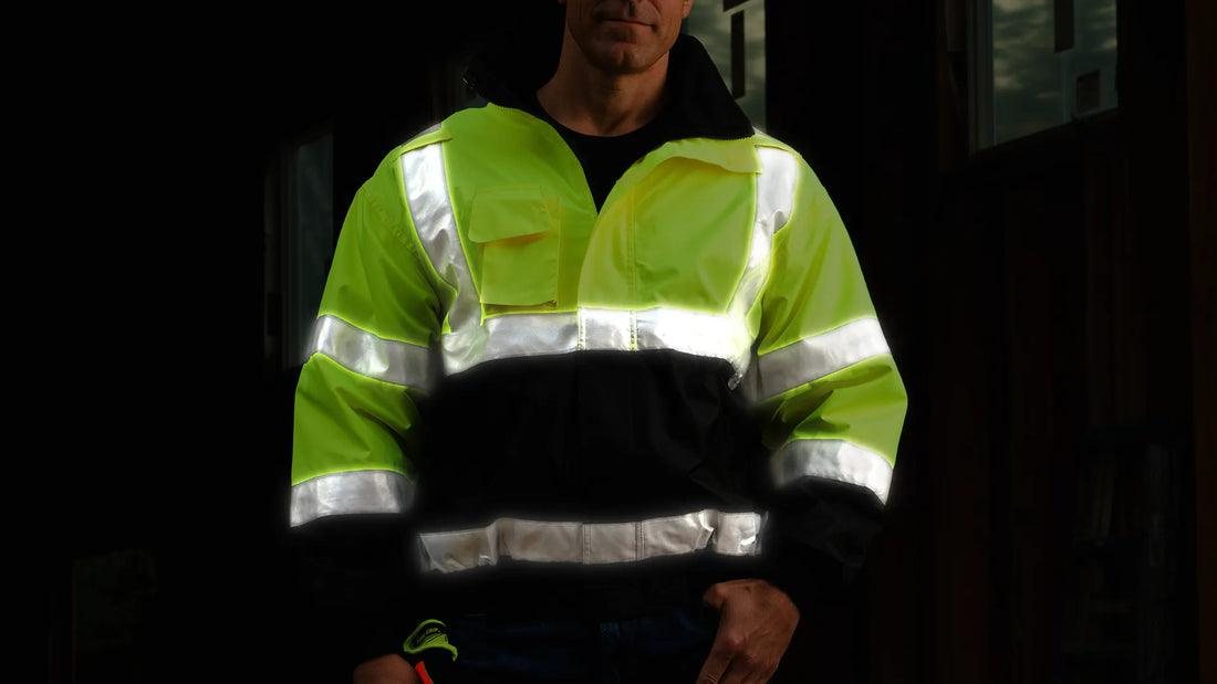 1370 hi-vis bomber jacket at night, reflective tape lit by headlights